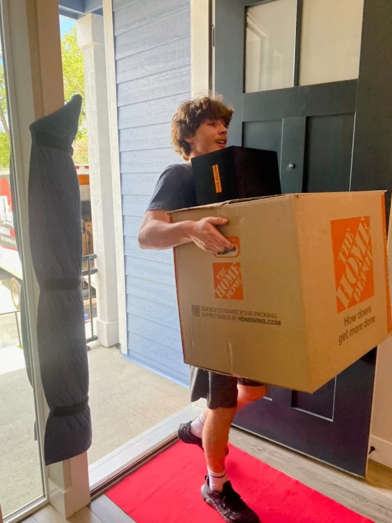 Henry carrying a large box