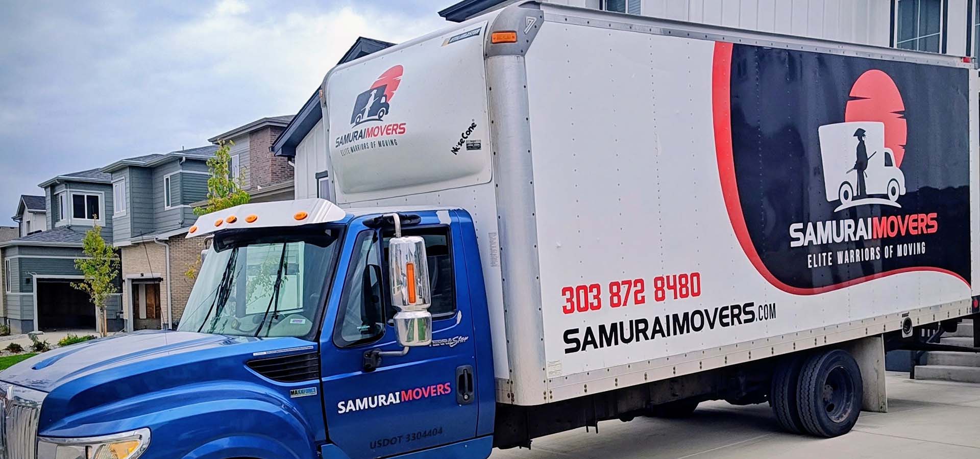 Samurai Movers residential moving truck parked in a Colorado neighborhood driveway